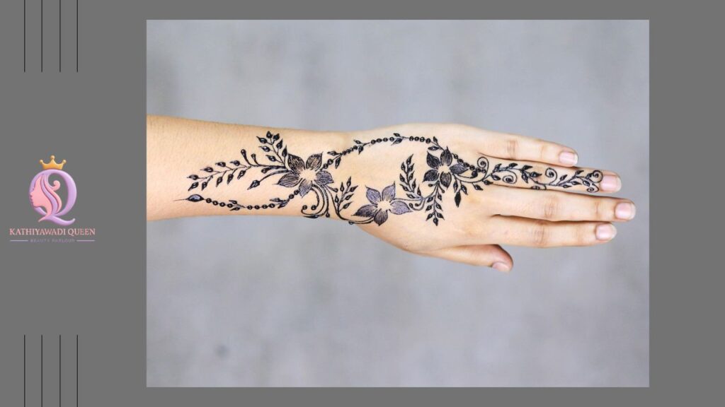 Stylish Arabic mehndi with floral and leafy trail on back hand