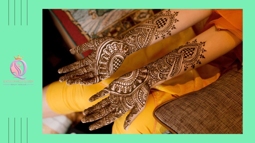 Stylish bridal mehndi with groom’s name and wedding symbols