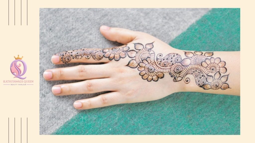 Minimal floral mehndi design on back hand with clean lines